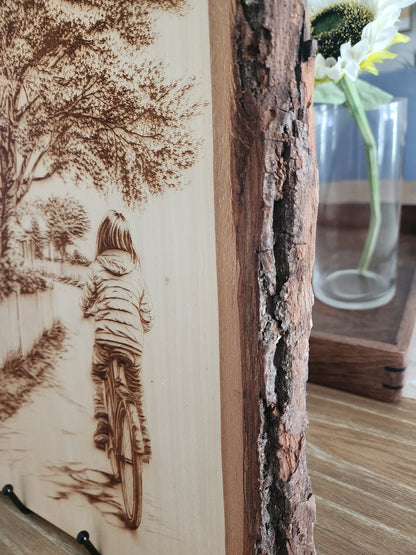 Small Town Peaceful Life Laser Engraving on Live Edge Wood – Girl on Bicycle Rustic Wall Art